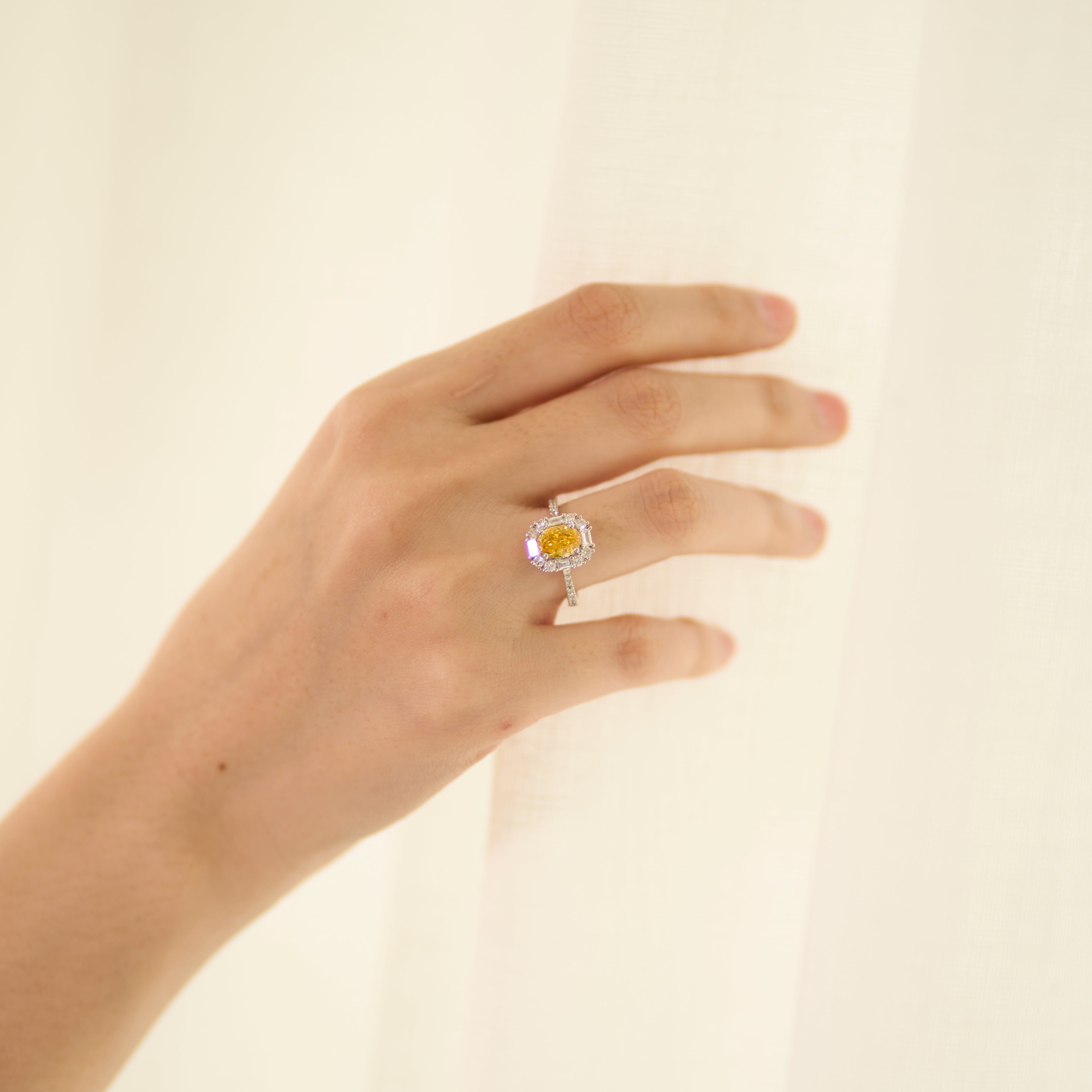 Oval Fancy Vivid Yellow Diamond Ring - Signature Baguette Halo