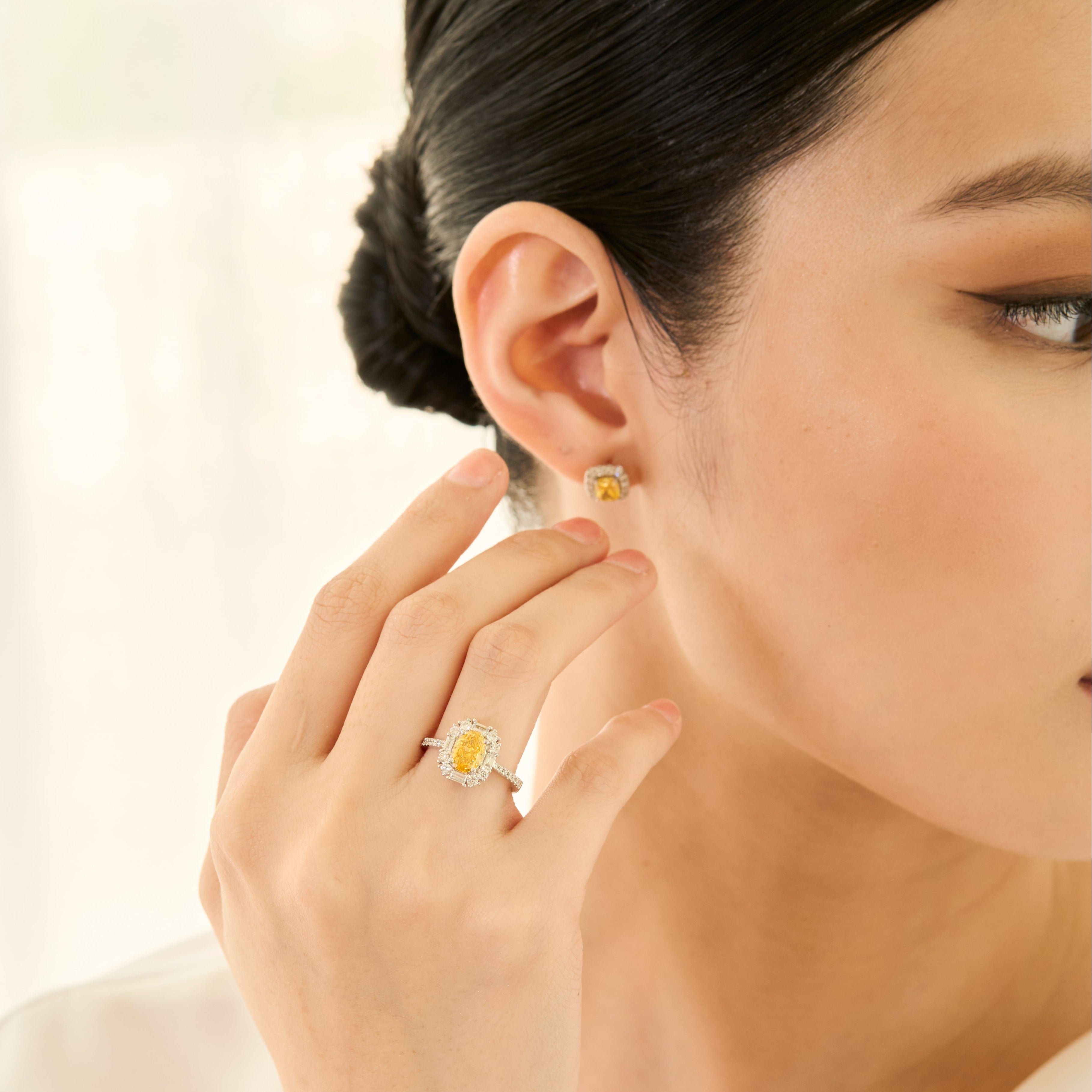 Oval Fancy Vivid Yellow Diamond Ring - Signature Baguette Halo
