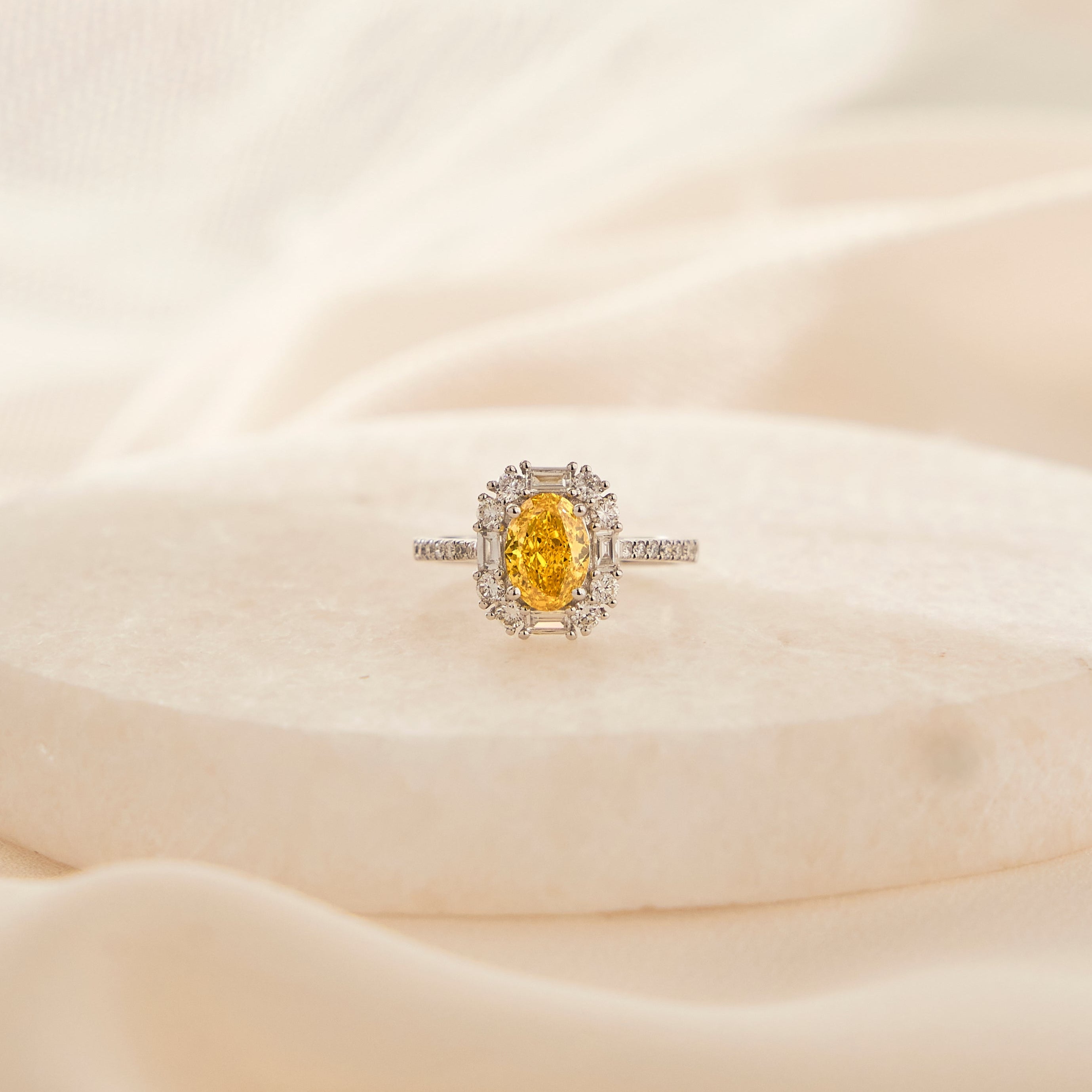 Oval Fancy Vivid Yellow Diamond Ring - Signature Baguette Halo
